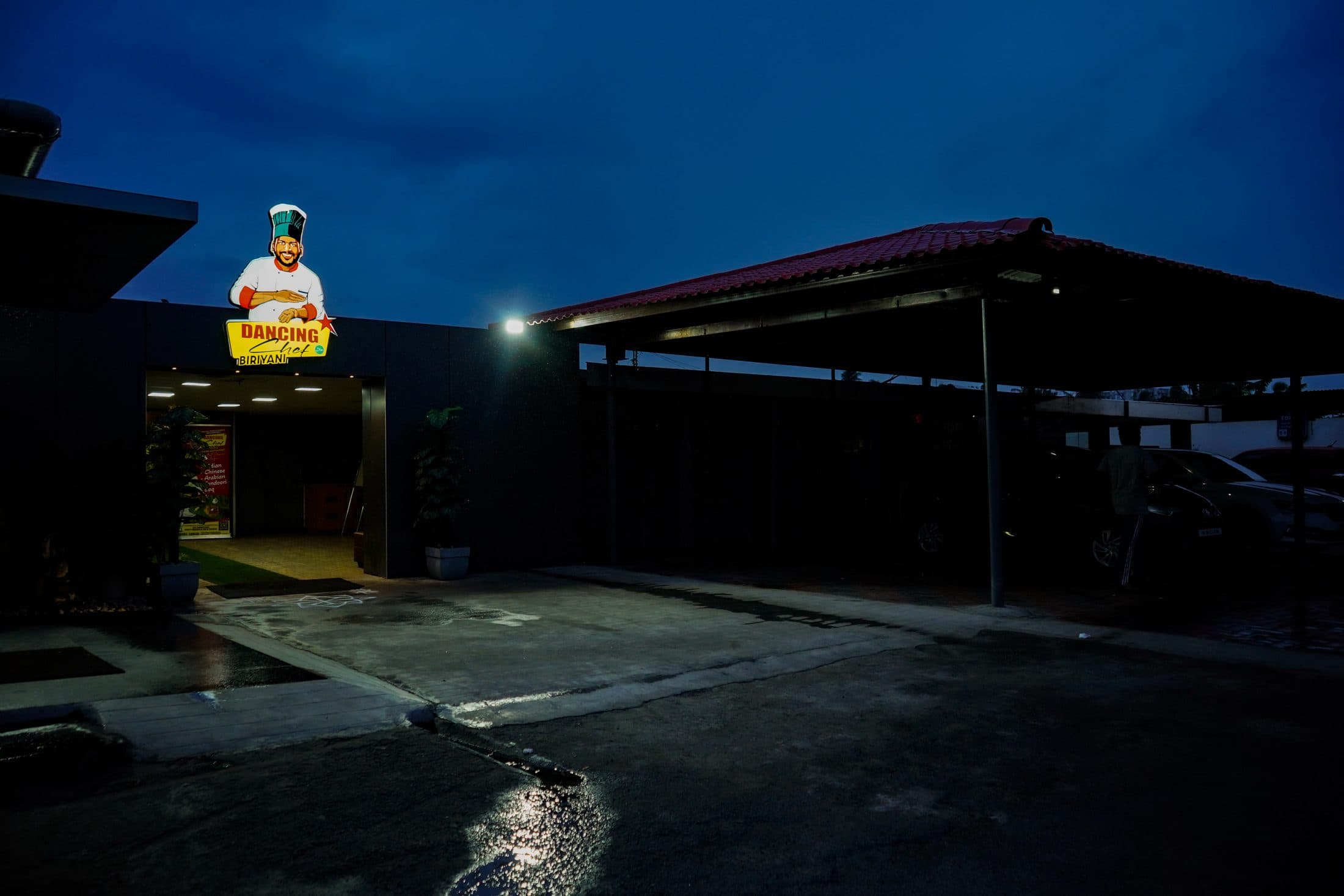The restaurant and its lit signage at dusk — Dancing Chef Biriyani, Coimbatore (6)