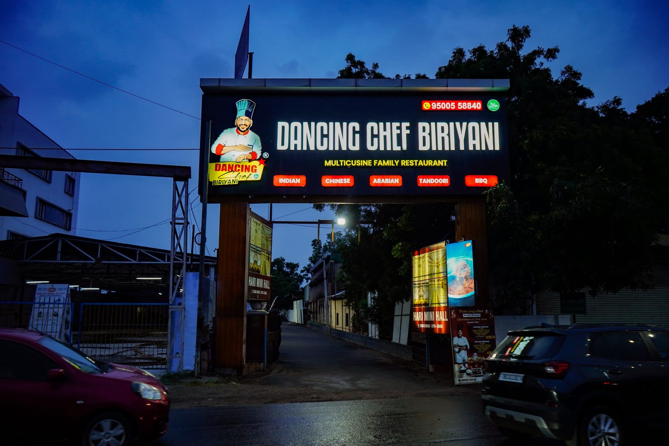 The restaurant and its lit signage at dusk — Dancing Chef Biriyani, Coimbatore (9)